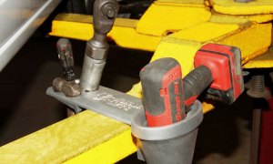 SWING ARM TOOL HOLDER